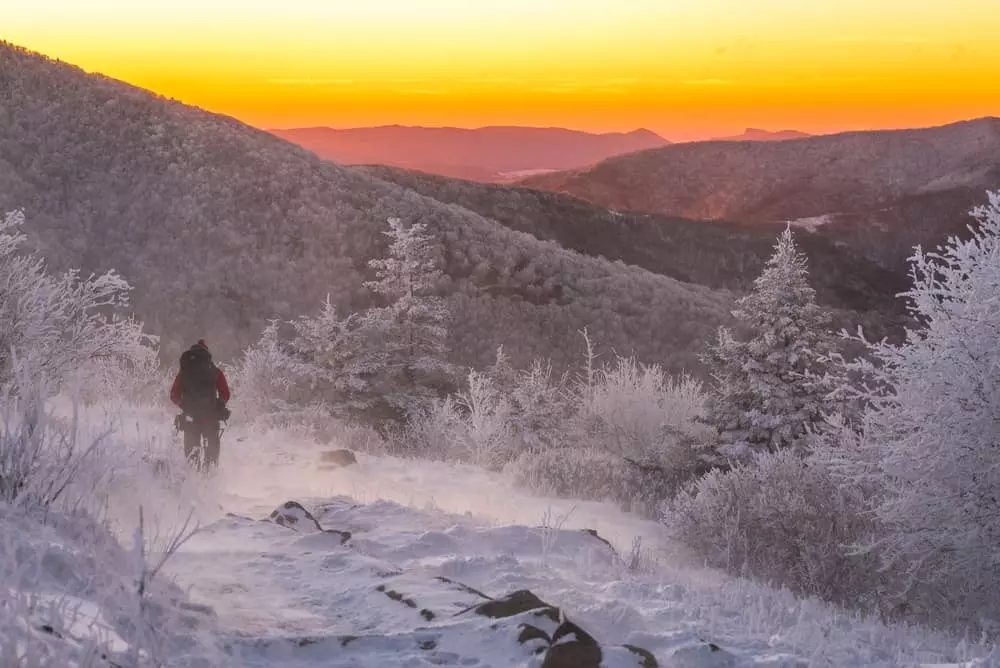 Hiker on a snow-covered trail in the Smoky Mountains