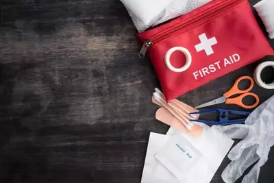 first aid kit on a wooden surface