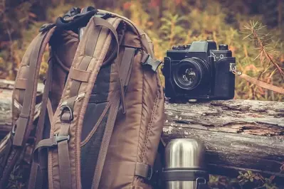 backpack with camera and canteen